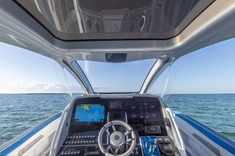 Loan Shark II Yacht Photos Pics Cockpit view of 2019 Deep Impact 399 Sport boat on open water.