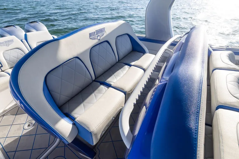 Loan Shark II Yacht Photos Pics Luxurious seating on 2019 Deep Impact 399 Sport boat, featuring blue and white upholstery.