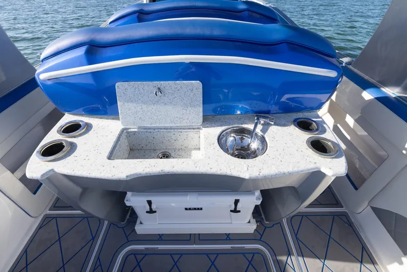 Loan Shark II Yacht Photos Pics 2019 Deep Impact 399 Sport boat interior with sink and cup holders.