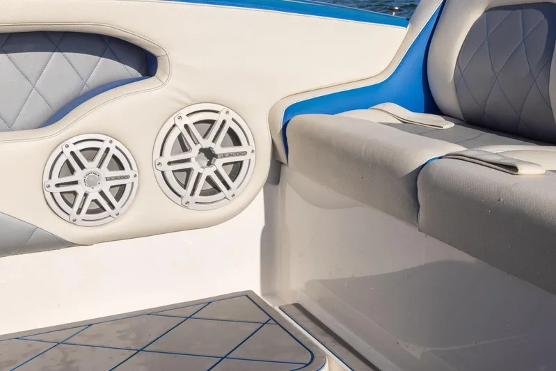 Loan Shark II Yacht Photos Pics Interior of 2019 Deep Impact 399 Sport boat with speakers and cushioned seating.