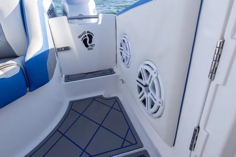 Loan Shark II Yacht Photos Pics Interior of 2019 Deep Impact 399 Sport boat with speakers and seating.