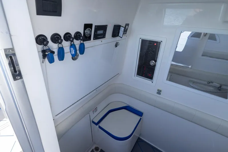 Loan Shark II Yacht Photos Pics Interior of 2019 Deep Impact 399 Sport boat with control panel and seating.
