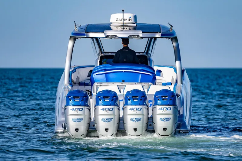 Loan Shark II Yacht Photos Pics 2019 Deep Impact 399 Sport boat with four powerful engines on open water.