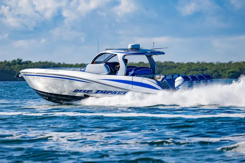 Loan Shark II Yacht Photos Pics 2019 Deep Impact 399 Sport boat cruising on open water, showcasing speed and performance.