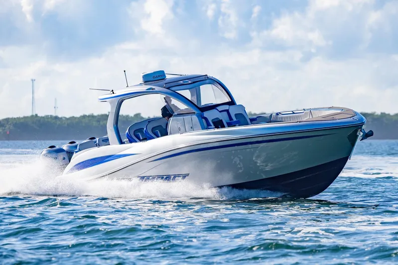 Loan Shark II Yacht Photos Pics 2019 Deep Impact 399 Sport boat cruising on open water, showcasing sleek design and performance.