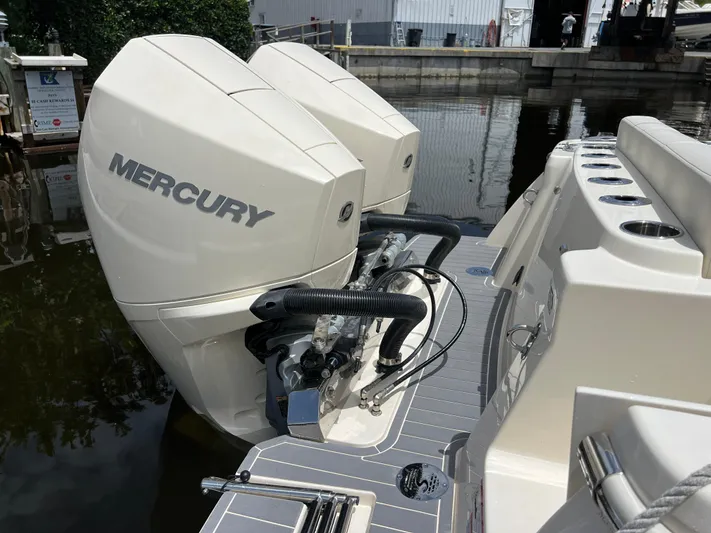  Yacht Photos Pics 2026 Scout 260 LXF boat with dual Mercury outboard engines at dock.