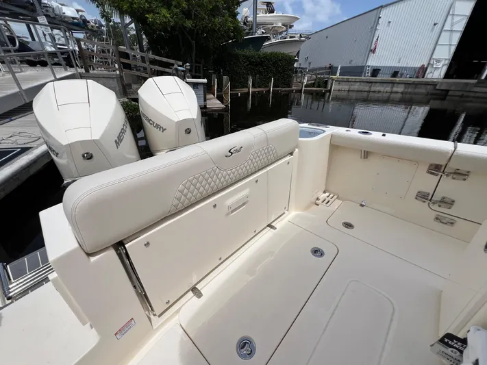  Yacht Photos Pics 2026 Scout 260 LXF boat interior with Mercury engines at a marina.