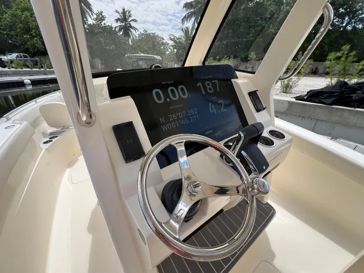  Yacht Photos Pics 2026 Scout 260 LXF boat dashboard with GPS display and steering wheel.