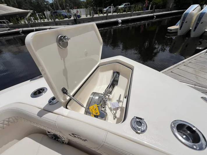  Yacht Photos Pics 2026 Scout 260 LXF boat with open anchor compartment at dockside.
