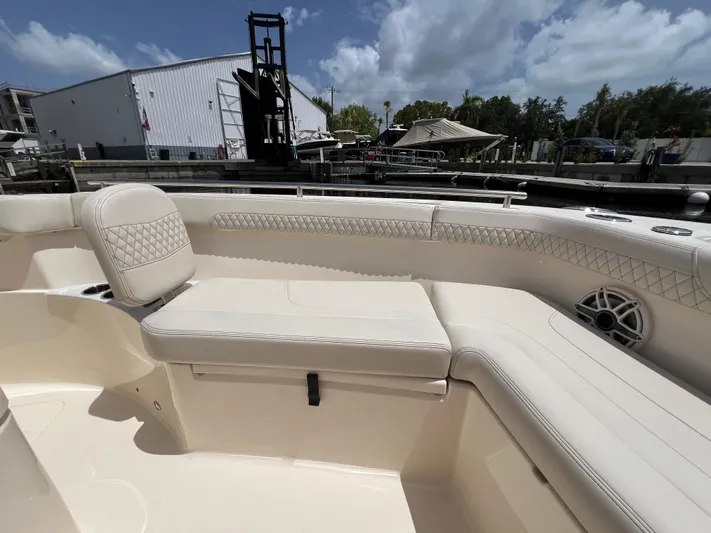  Yacht Photos Pics 2026 Scout 260 LXF boat interior with luxurious seating and speaker system.