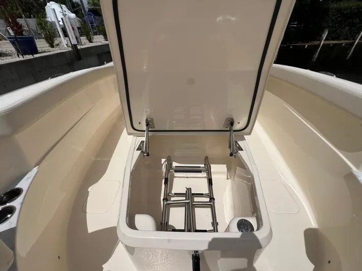  Yacht Photos Pics 2026 Scout 260 LXF boat with open storage compartment and ladder.