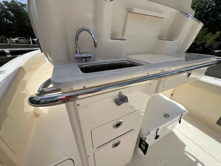  Yacht Photos Pics 2026 Scout 260 LXF boat interior with sink and storage compartments.