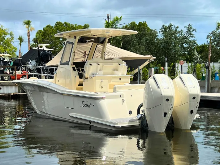  Yacht Photos Pics 2026 Scout 260 LXF boat docked with dual outboard engines.