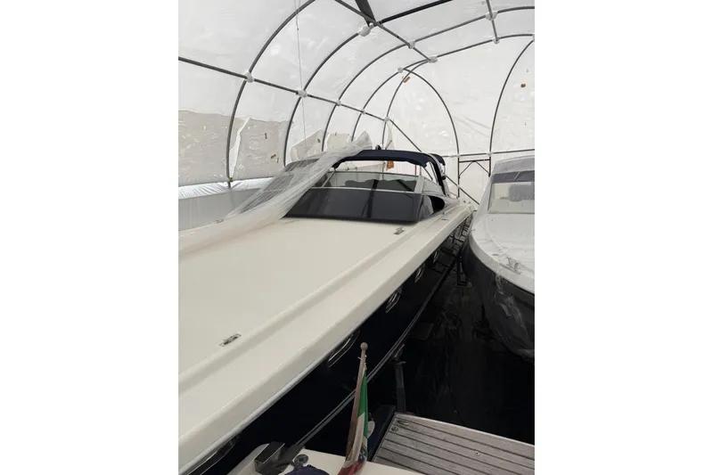  Yacht Photos Pics 1998 Otam Cigarette Heritage 45 boat stored in a covered shelter.