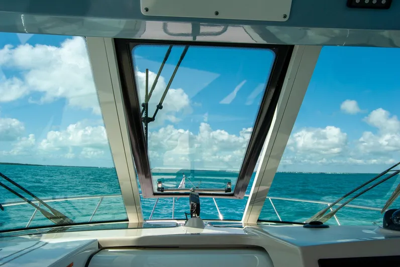  Yacht Photos Pics 2021 Boston Whaler 345 Conquest boat view, open sea, clear sky, through windshield.