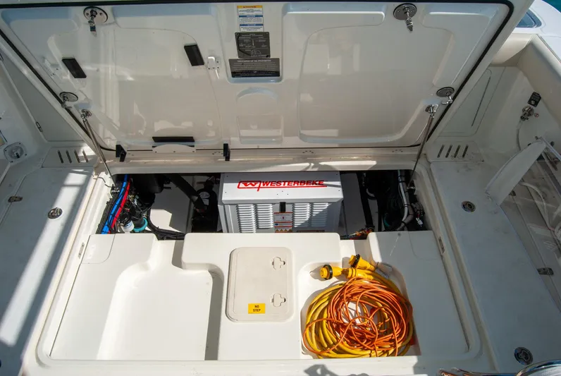  Yacht Photos Pics 2021 Boston Whaler 345 Conquest engine compartment with Westebeke generator and coiled power cords.