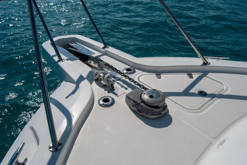  Yacht Photos Pics 2021 Boston Whaler 345 Conquest bow with anchor system on blue ocean water.