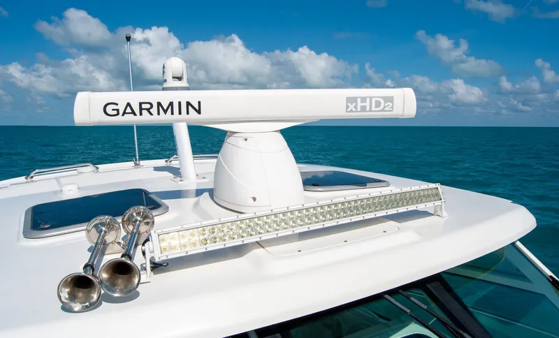  Yacht Photos Pics 2021 Boston Whaler 345 Conquest with Garmin radar on open sea under blue sky.