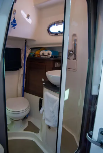  Yacht Photos Pics 2021 Boston Whaler 345 Conquest bathroom with toilet, sink, and storage.