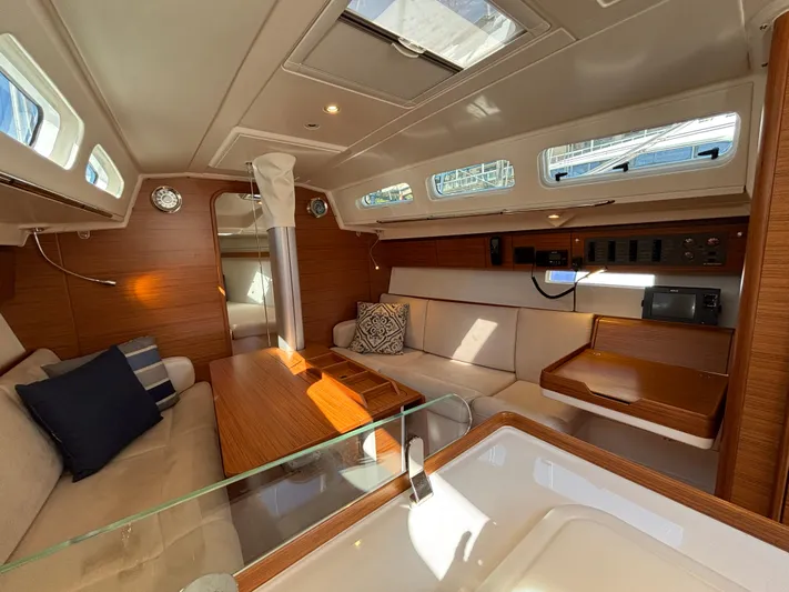 Rambunxious Yacht Photos Pics Luxurious interior of 2014 X-Yachts Xp 38 sailboat with elegant wood finish.