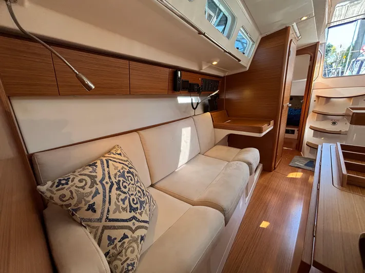 Rambunxious Yacht Photos Pics Luxurious interior of 2014 X-Yachts Xp 38 sailboat with elegant wood finish.