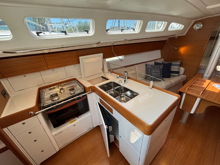 Rambunxious Yacht Photos Pics Interior of 2014 X-Yachts Xp 38, featuring modern kitchen and cozy seating area.