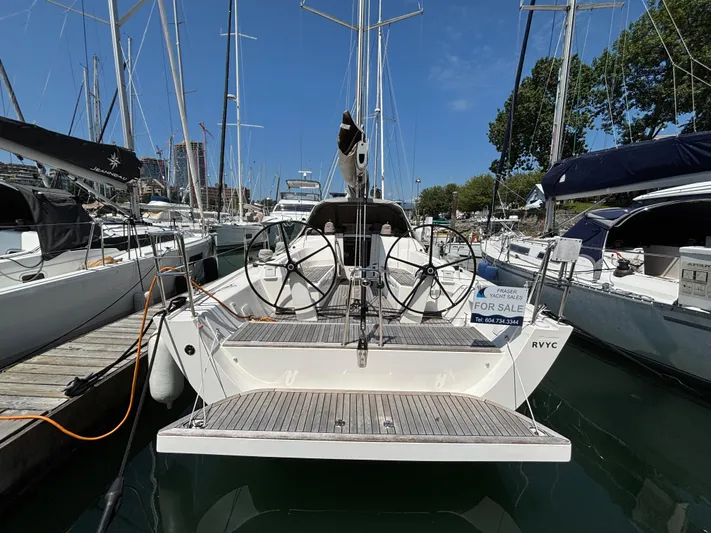 Rambunxious Yacht Photos Pics 2014 X-Yachts Xp 38 sailboat for sale at marina, clear sky background.