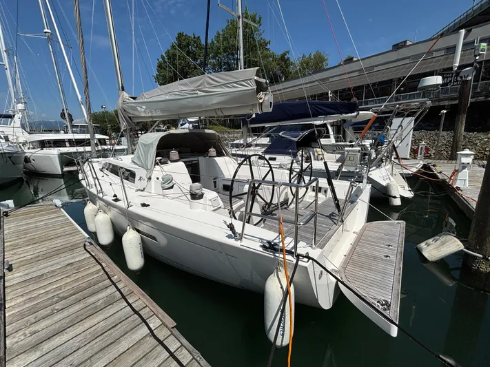 Rambunxious Yacht Photos Pics 2014 X-Yachts Xp 38 sailboat docked at marina, featuring sleek design and modern rigging.