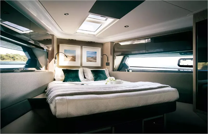  Yacht Photos Pics Luxurious bedroom interior of 2018 Azimut Atlantis 51 yacht with elegant decor and natural light.