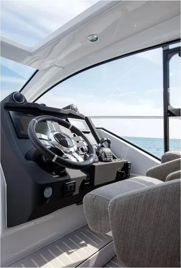  Yacht Photos Pics Interior view of 2018 Azimut Atlantis 51 yacht cockpit with ocean backdrop.