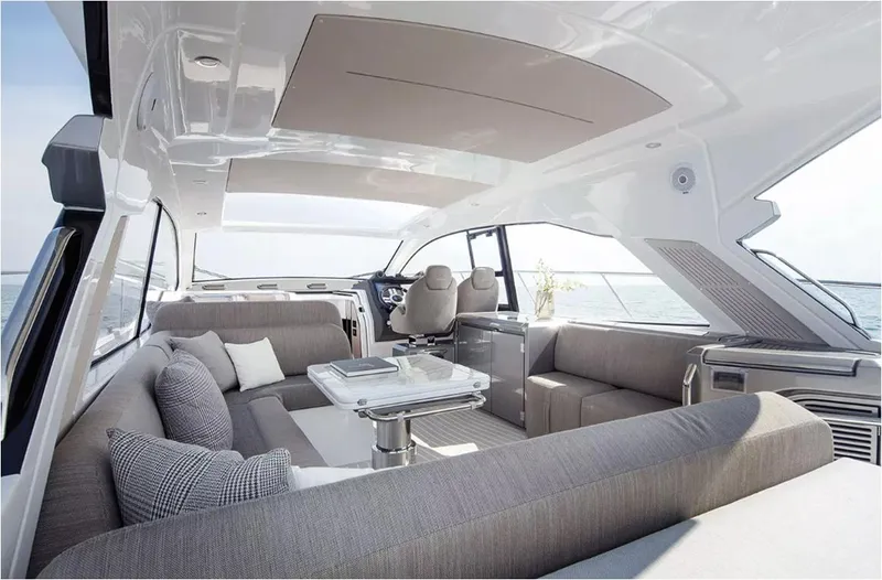  Yacht Photos Pics Luxurious interior of 2018 Azimut Atlantis 51 yacht with elegant seating and panoramic views.