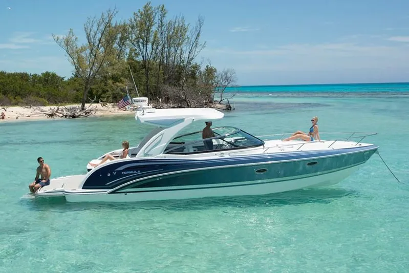  Yacht Photos Pics Manufacturer Provided Image: 2020 Formula 350 Sun Sport boat in clear turquoise water near a tropical beach.