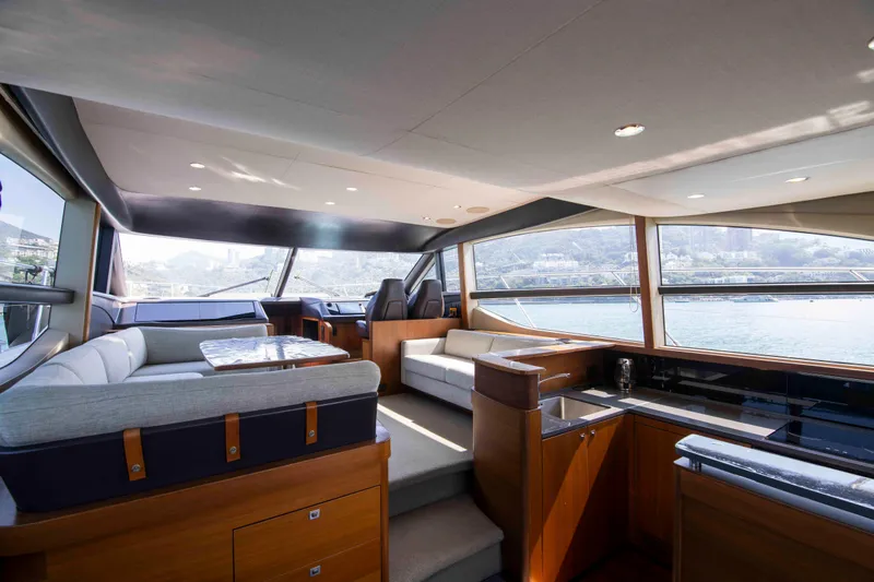  Yacht Photos Pics Luxurious interior of a 2017 Princess 52 yacht with panoramic windows and modern furnishings.