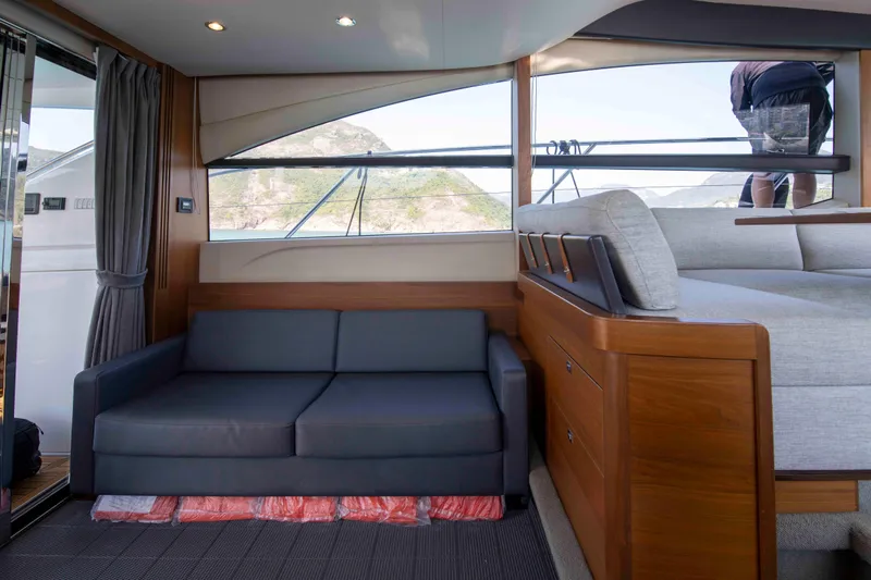  Yacht Photos Pics Luxurious interior of 2017 Princess 52 yacht with sofa and bed.