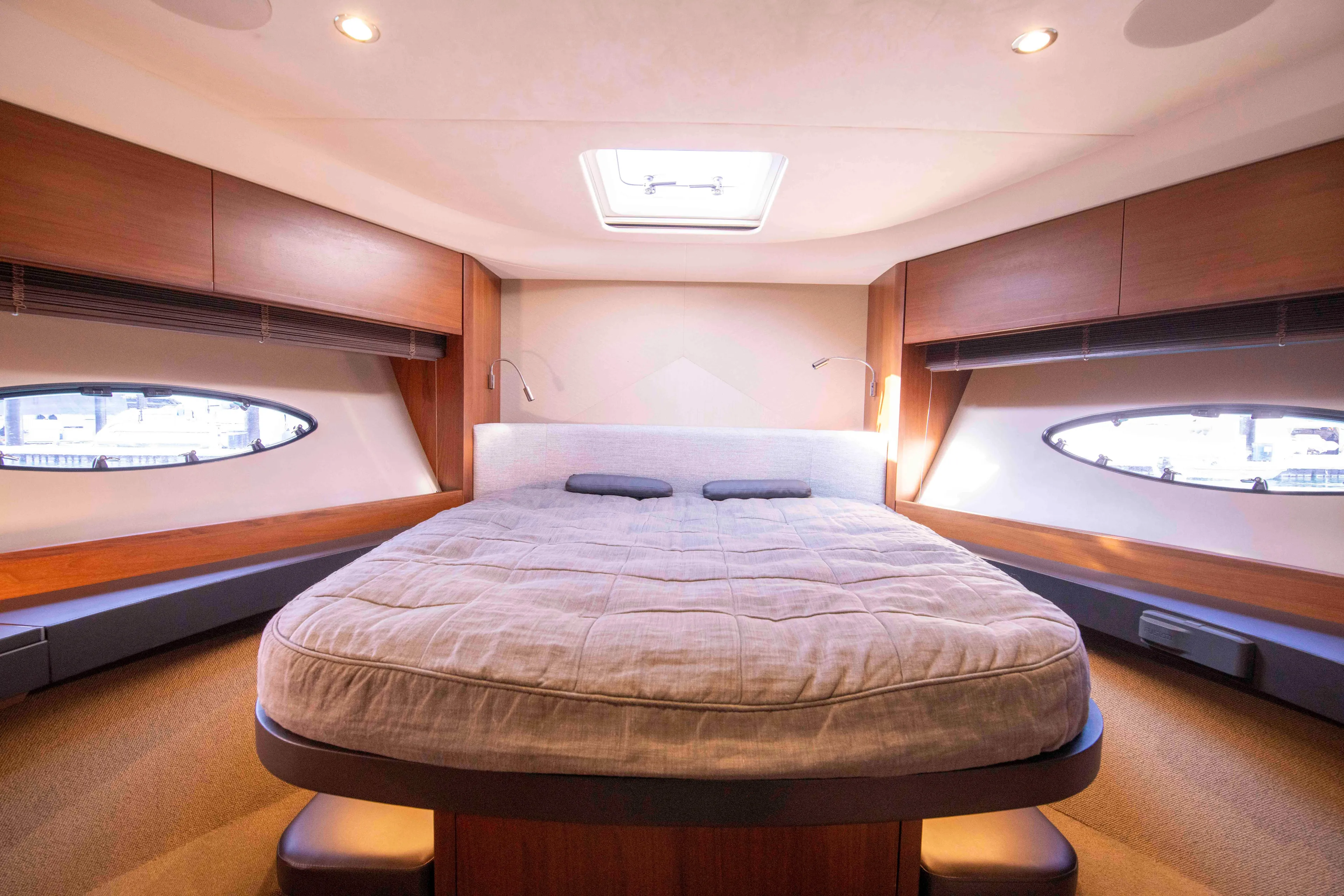  Yacht Photos Pics Luxurious cabin interior of 2017 Princess 52 yacht with elegant wood finishes.