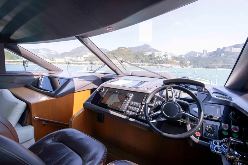  Yacht Photos Pics Luxurious 2017 Princess 52 yacht cockpit with modern navigation controls and scenic ocean view.