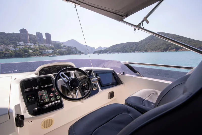  Yacht Photos Pics Luxurious 2017 Princess 52 yacht cockpit with scenic coastal view.