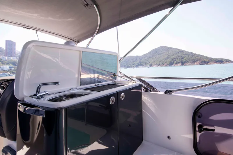  Yacht Photos Pics Luxury yacht Princess 52 (2017) with sleek outdoor kitchen and scenic ocean view.