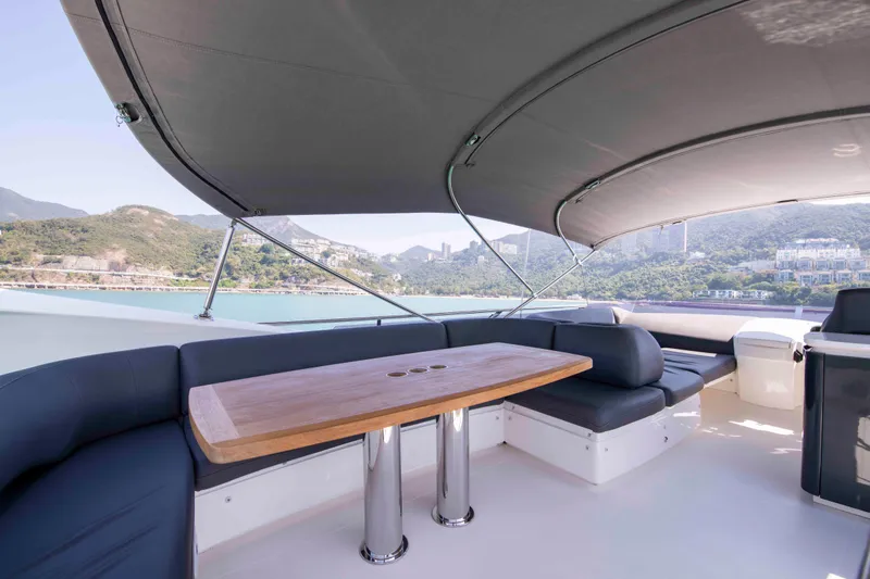  Yacht Photos Pics Luxurious seating area on 2017 Princess 52 yacht with scenic coastal view.