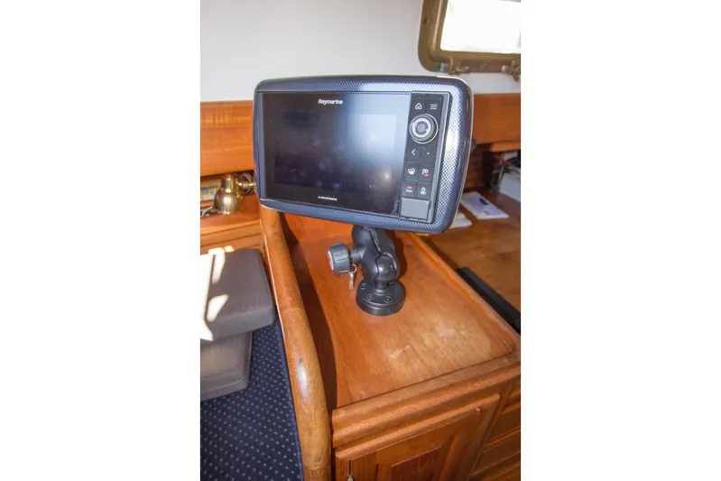 Sea G Yacht Photos Pics Raymarine navigation system on 1983 Cape George Cutter sailboat interior.