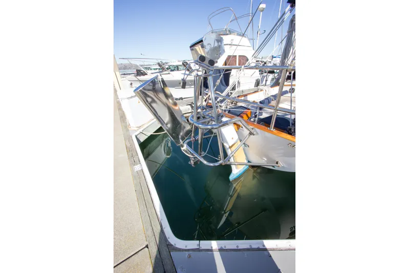 Sea G Yacht Photos Pics 1983 Cape George Cutter sailboat docked, showcasing polished metalwork and nautical equipment.