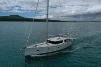 Sailing yacht Moody DS 45, 2011 model, cruising on calm waters under a cloudy sky.
