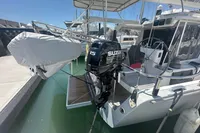 Sailboat Moody DS 45 (2011) with Suzuki outboard motor docked at marina.