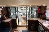 Interior of 2011 Moody DS 45 yacht with modern kitchen and seating area.