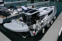 Sailboat Moody DS 45, 2011 model, docked at marina with solar panels and covered dinghy.