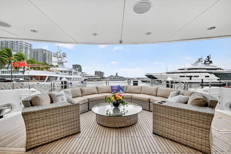 About Time Yacht Photos Pics Luxurious Sunseeker 40 Metre Yacht 2010 with elegant outdoor seating and waterfront view.