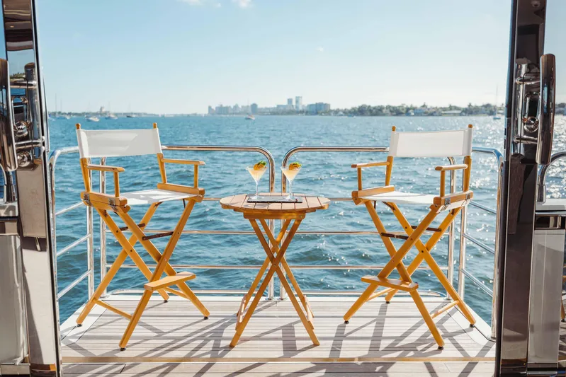 About Time Yacht Photos Pics Deck view of 2010 Sunseeker 40 Metre Yacht with chairs and drinks.