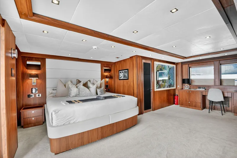 About Time Yacht Photos Pics Luxurious Sunseeker 40 Metre Yacht 2010 bedroom with elegant wood paneling and modern decor.