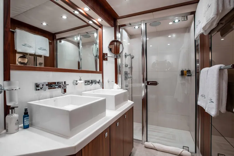 About Time Yacht Photos Pics Luxurious bathroom on 2010 Sunseeker 40 Metre Yacht with dual sinks and glass shower.