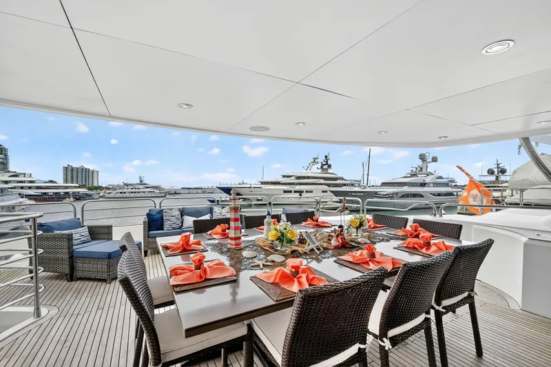 About Time Yacht Photos Pics Luxurious Sunseeker 40 Metre Yacht 2010 with elegant outdoor dining setup and marina view.